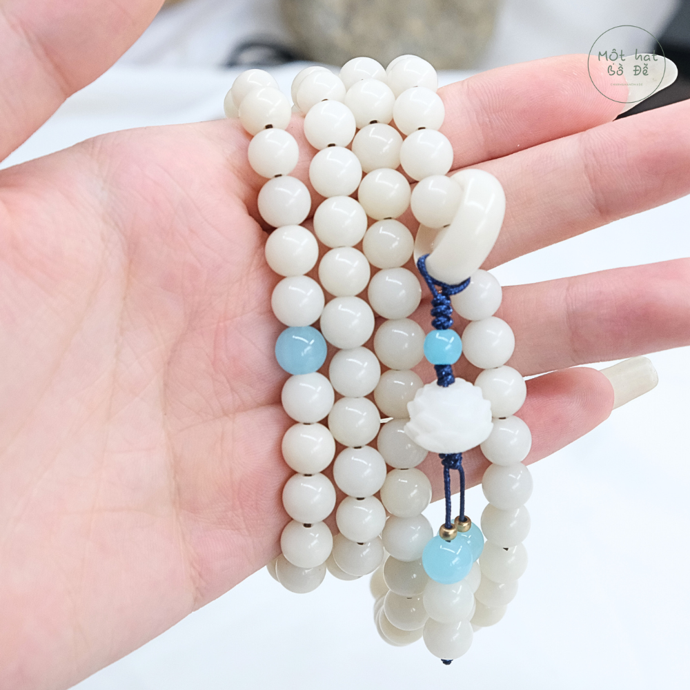 Chuỗi 108 hạt bồ đề trắng 8 ly, mix 1 hạt đá xanh dương, nhẫn trắng phối hoa sen trắng | Chồi Nhỏ | Chuỗi hạt niệm Phật bồ đề 5 Chuỗi 108 hạt bồ đề trắng 8 ly, mix 1 hạt đá xanh dương, nhẫn trắng phối hoa sen trắng | Chồi Nhỏ | Chuỗi hạt niệm Phật bồ đề - Ảnh 5
